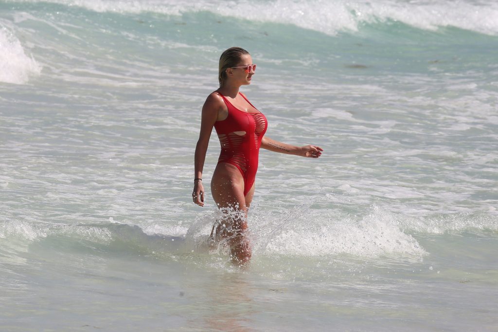 Caroline Vreeland’s Pokies In a Red Swimsuit